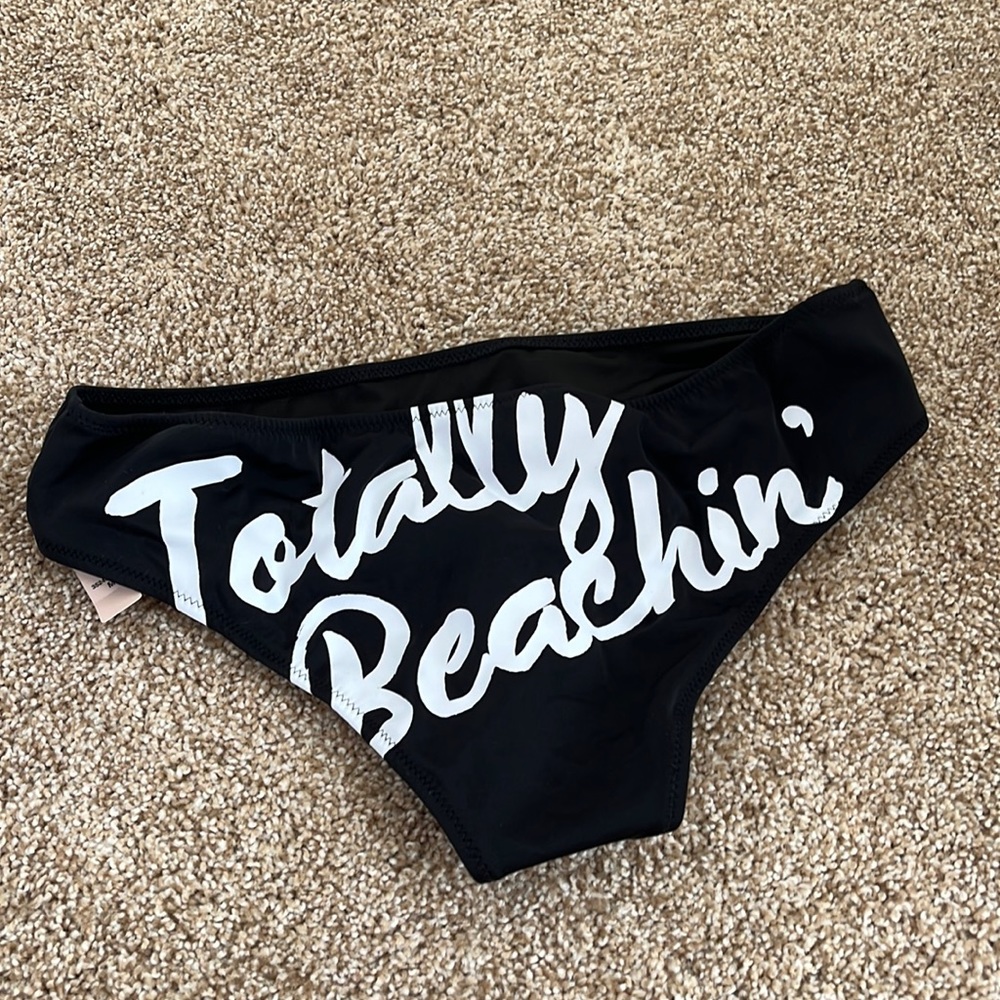 Victoria’s Secret bathing suit bottoms. Medium never worn with tag
